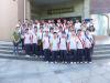 Teachers and students are taking a group photo in front of the Chung Ying History Museum.