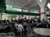 Students are enjoying their lunch in the canteen with their classmates and class teacher.