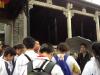 Students are listening to the tour guilde carefully about the study hall called  Chen Clan Ancestral Hall.