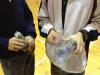 Two students were performing with a plastic bottle and robber bands.