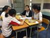 The students were having a group discussion about the job.