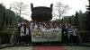 A group picture in front of a ‘ding’ ( a three-legged ancient Chinese cooking vessel ).