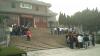 Students are listening to a tour guide's introduction outside Yuejianglou.