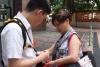 Students walked around Mei Foo to sell the flags to the residents.