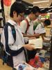 Participants are reading the books intently.