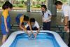 A group of students were trying out their boat before the competition.