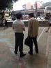 The student is listening to the elderly attentively.