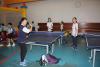 Students were having an exciting table tennis competition.
