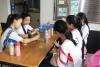 The girls were creating their own art pieces with bottles of colorful sand.