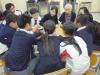 One of the elderly is demonstrating how to play a traditional game.