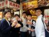 Students got their own lunch after half day of work in the street.