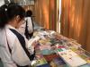 Students are reading the books they like during the book fair.