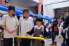 A primary pupil could learn Chinese through a ring toss game.