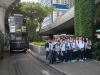 Students are waiting for a relaxing and elegant way to travel on a beautiful vintage tram.