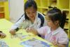 Our students were playing puzzles with the children.