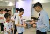 Students were playing with the Principal happily.