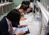 Students were attempting the questions with iPads.