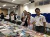 Students enjoy reading in the book fair.