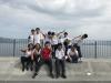 Students and teachers are relaxed in an outdoor environment.