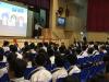 The speaker invited students to participate in a voting activity.