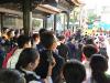 Students watch a lion dance performance.