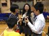 Parents and students have a happy conversation with the teachers. 