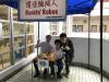 This photo was taken at the reception booth. Both students and guests were interested in operating the bubble-blowing machine.