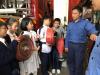 Students are trying to hold the hose reels.