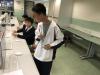 A student was holding the motion sensor and reading the rules of the computer game.