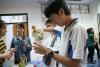 Student focuses on making a handmade gift.