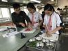 Students are trying to mince the beef for the beef broth.