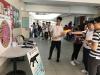 Students are playing at the anti-drug game booths during recess.