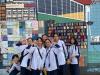 Group photo taken in front of the Wavy Weaving Wall.