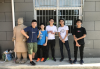 Maths Team takes a photo with a Terra-Cotta Warrior in Xi An.