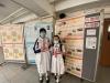 Two girls are happy as they have won a prize in the game of the National Security Law exhibition