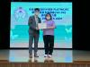 Principal Wong was presenting the Letter of Commission to a parent-candidate.
