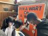 Students pinning a wart on the witch