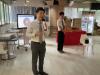 The principal giving an opening speech to all teachers and staff
