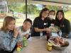 Students try to make steamed glutinous rice cake with their family.