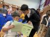 A primary student is curious about a science workbook.