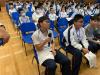 Students actively respond to the speaker’s questions in the talk.