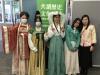 Students with costumes of Tang Dynasty take a group photo.