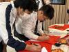 Students write "Hui Chun" to experience the Chinese traditional cultural.