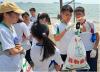 Students are measuring the weight of all the waste collected. 