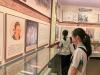 Students are admiring the historical figures.