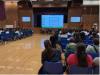 Students and parents attend the talk in large numbers.