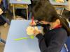 Students write supportive messages to be displayed in the classroom.