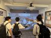 Students are playing games in the museum.