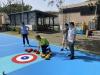 Strategising the next moves in Floor Curling, while aiming for the target area on the court