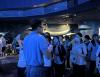 A brief introduction for students about ensuring the well-being of aquatic life and the cleanliness of the environment before entering the back house of the aquarium